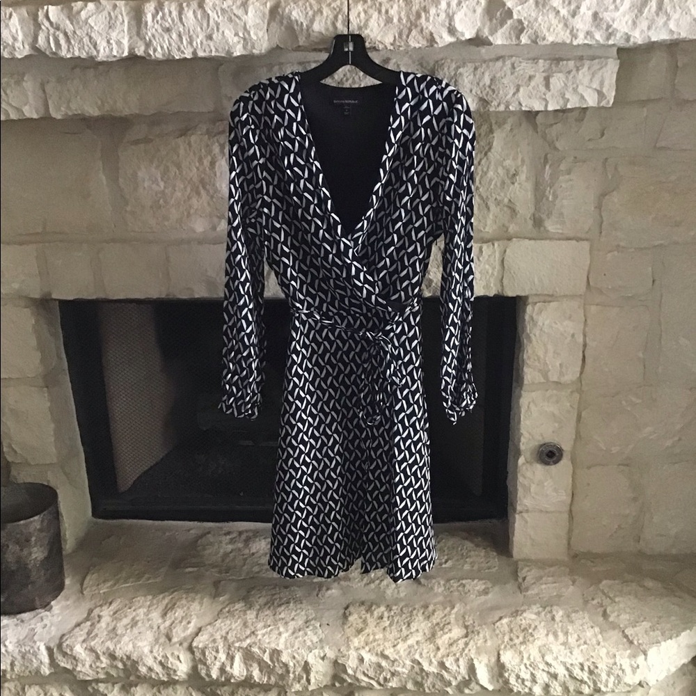 Beautiful Black, Blue and White Faux Wrap dress.